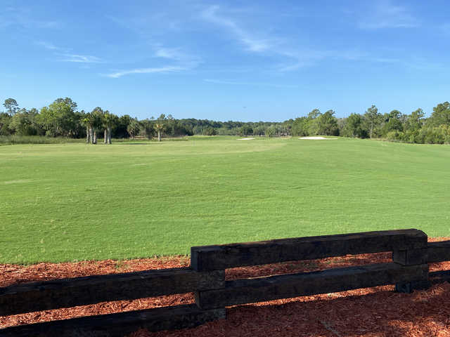 View of a green and fairway at Sanctuary Golf Club.