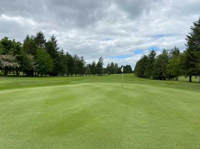 A cloudy day view of a hole at Ballyclare Golf Club.