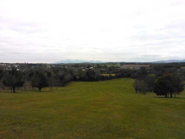 A cloudy day view of a fairway at Crossgar Golf Club.