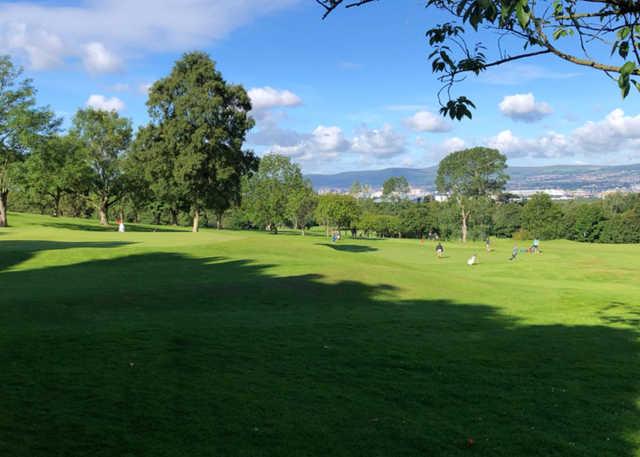 A sunny day view of a hole at Holywood Golf Club.