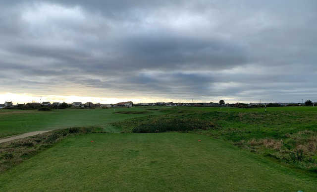 A cloudy day view from a tee at Kirkistown Castle Golf Club.