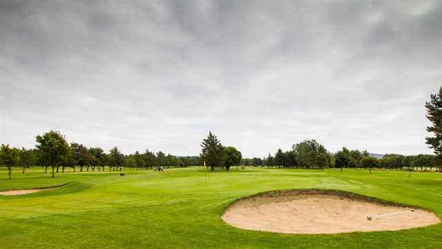 A view of a green protected by bunkers at Alford Golf Club.