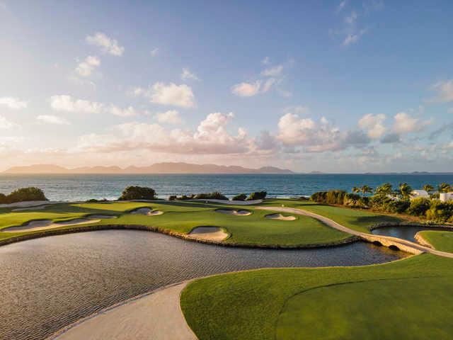 View of green protected by bunkers at Aurora International Golf Club
