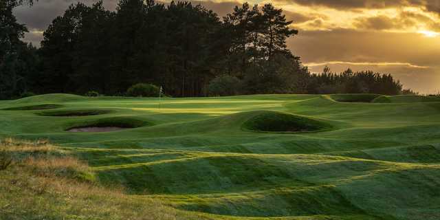 A sunset view of a hole at Forfar Golf Club.