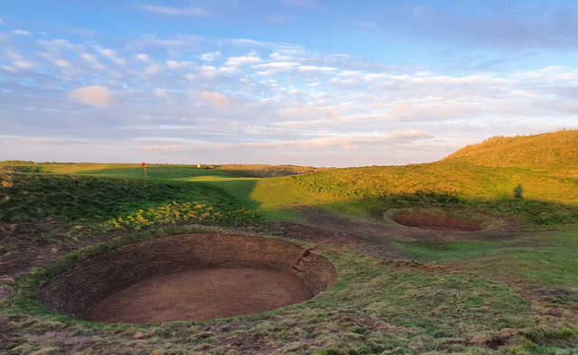A view of hole #12 bunkers at Championship Course from Machrihanish Golf Club.