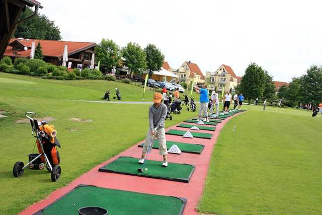 A view of the driving range tees and clubhouse on the left at Dresden Ullersdorf Golf Club