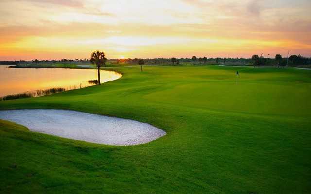 A sunrise view of a green with water coming into play from left (Jason Myers)