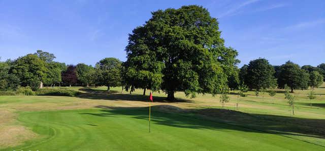 A sunny day view of a green at Liberton Golf Club.