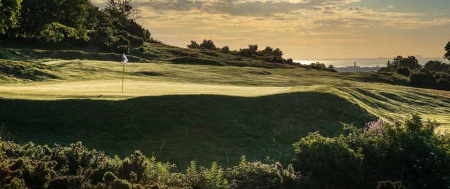 A sunset view of a hole at Murrayfield Golf Club.