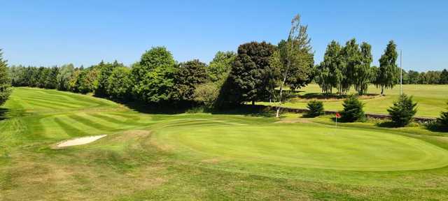 A sunny day view of a green at Falkirk Golf Club.
