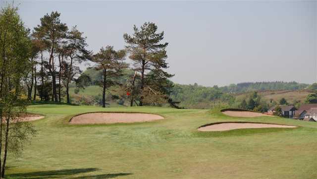 A view of a green surrounded by bunkers at Old Course Ranfurly Golf Club.