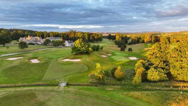 A sunny day view of two greens at SCHLOSS Roxburghe Golf Course.