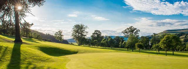 A sunny day view of a hole at Torwoodlee Golf Club.