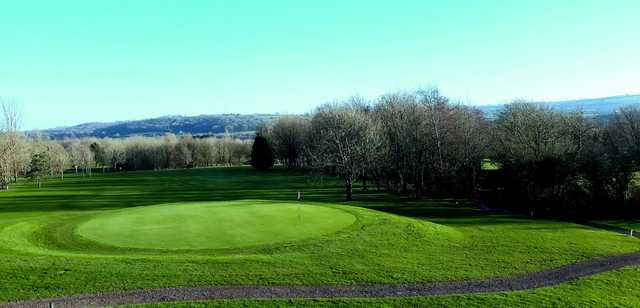 An early morning view of a hole at Coed-y-Mwstwr Golf Club.
