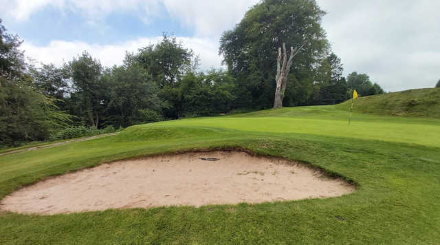 A view of a green protected by a tricky bunker at Blackwood Golf Club.