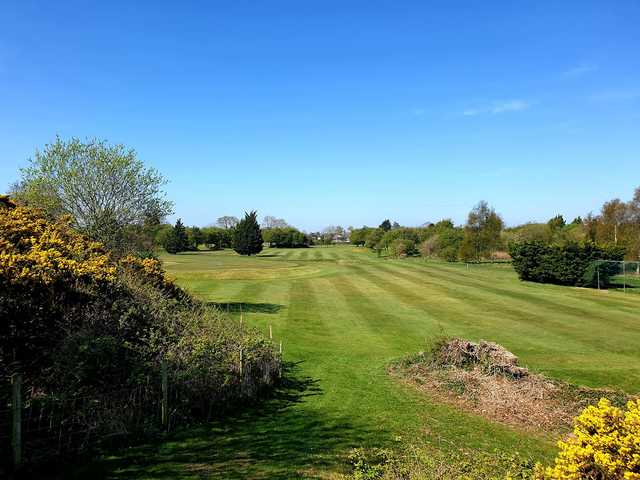 A sunny day view from Holywell Golf Club.