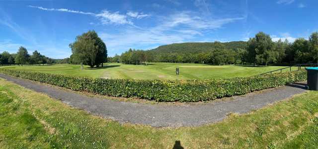 A sunny day view of a tee and a green at Mond Valley Golf Club.