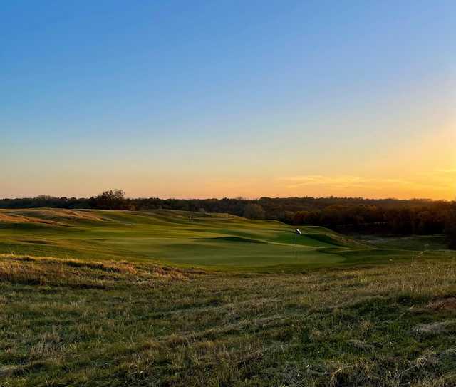 Sunset view of a green at Fyre Lake Golf Club.