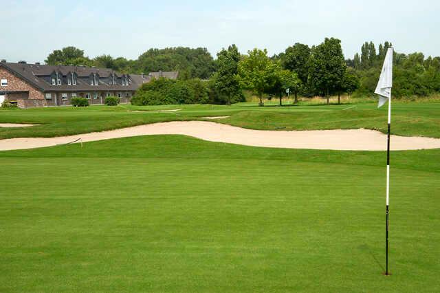 A view of two greens and the clubhouse at Niep Golf Club.