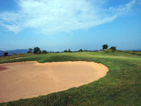 A view of green #7 with bunker in foreground at Raven Rock Golf Course