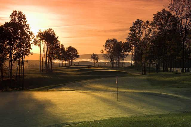 A dusk view of the 5th green at Blue Ridge Shadows Golf Club (PDI Chris John).