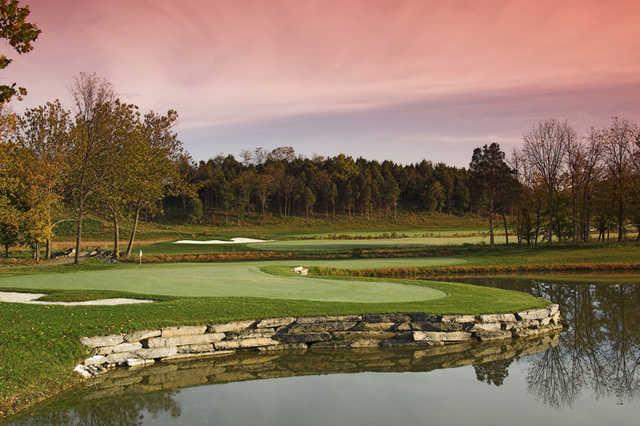 A view of green #14 surrounded by bunkers at Blue Ridge Shadows Golf Club (PDI Chris John).