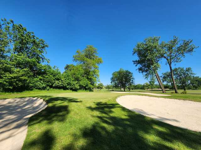 View of a green and bunkers from Warren Valley Golf Course.