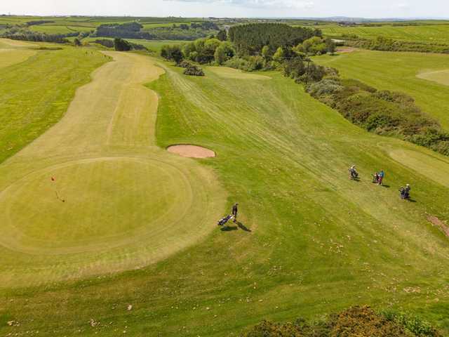 Aerial view of the 13th green and 14 tee and fairway at Mawgan Porth Golf Club.