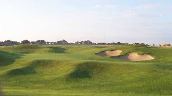 A view of the 5th green protected by bunkers at WestRidge Golf Course