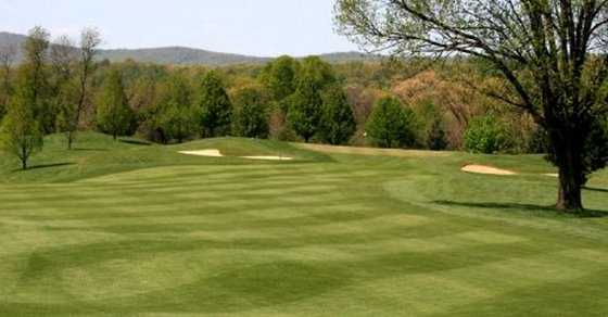 A view of a green protected by bunkers at Little Bennett Golf Course