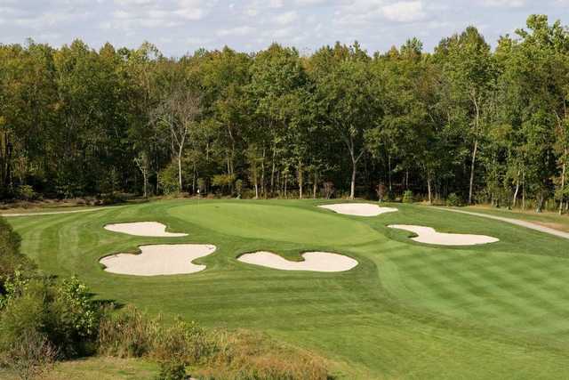 A view of a green surrounded by bunkers at Renditions Golf Course.