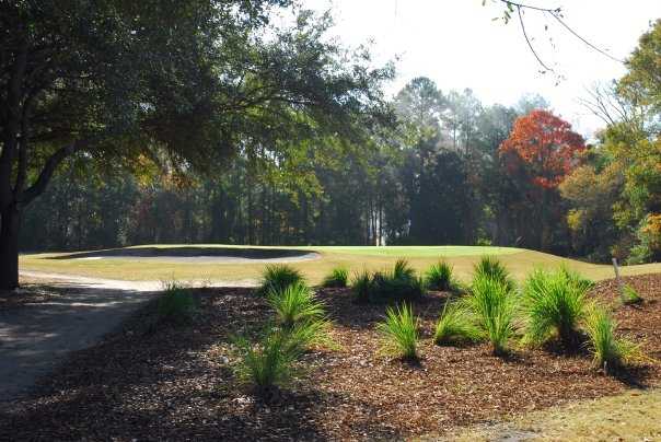 A view of a green protected by a bunker at Olde Beaufort Golf Club.
