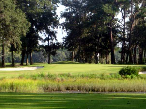 A view of green protected by bunkers at Sanctuary Golf Club