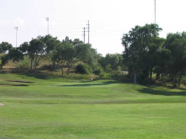 A view of a green with bunkers on the left at Canyon Course from Meadowbrook Golf Complex