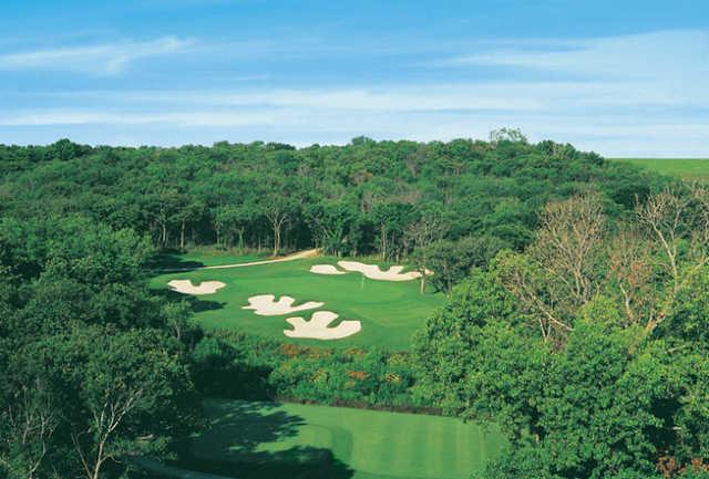 A view of green #17 surrounded by bunkers at Cowboys Golf Club
