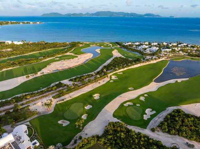 Aerial view of the 18th and 12th greens from International Course at Aurora Anguilla Resort & Golf Club.