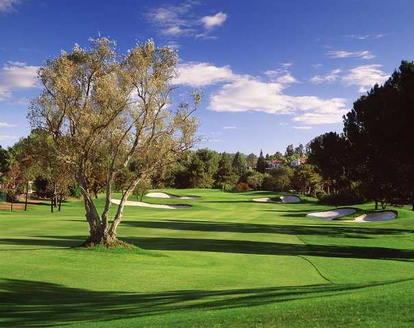 A view of a green protected by bunkers at Rancho Bernardo Inn.