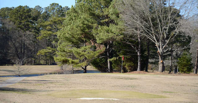 A sunny day view of a hole at Green Briar Golf Course.