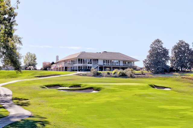 A view of the clubhouse and a green at Saugahatchee Country Club.