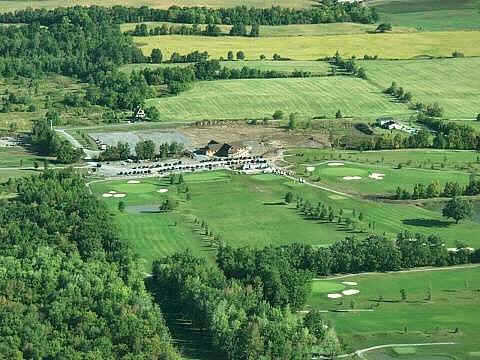 Aerial view of the clubhouse and driving range at Lima Golf & Country Club - Island Oaks