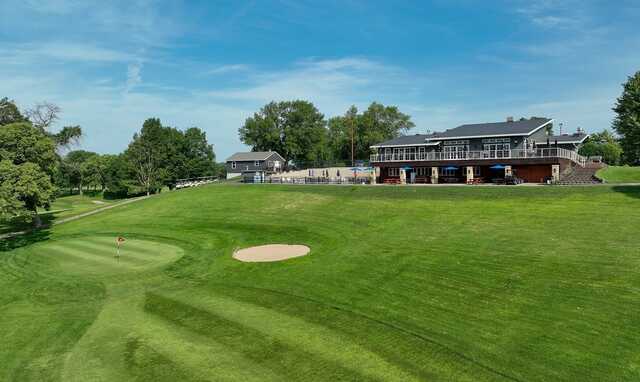 View of a green and clubhouse from Shoreland Country Club.