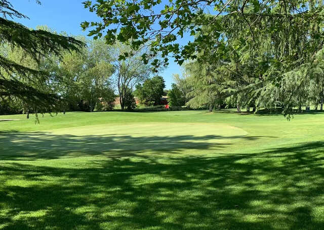 A sunny day view of a hole at Antelope Greens Golf Course.