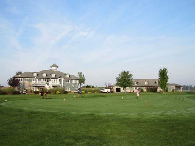 A view of the clubhouse and putting green at Orchards Golf Course