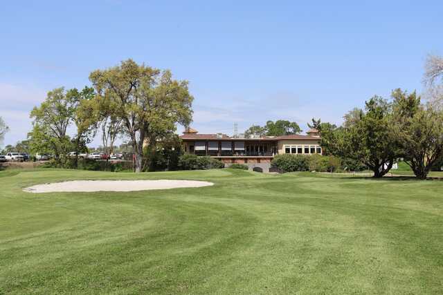 A view of a green and the clubhouse at La Contenta Golf Club.