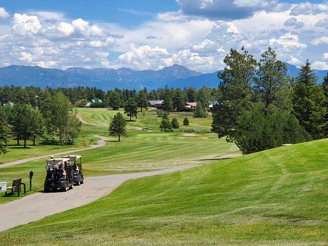 A sunny day view of a hole at Pagosa Springs Golf Club.