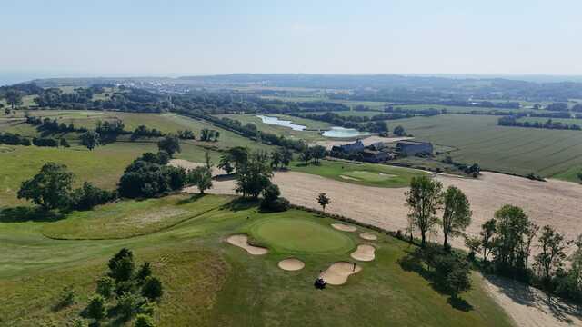 Aerial view of the 14th green from Patton Course at Omaha Beach Memorial Golf Club.