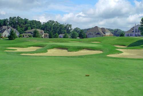 A view of green #11 surrounded by bunkers at Stonewolf Golf Club
