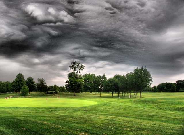 A cloudy view of the practice putting green at Rolling Hills Golf Club