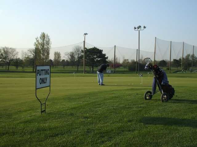 A view of the practice putting green at 	Fresh Meadow Golf Course