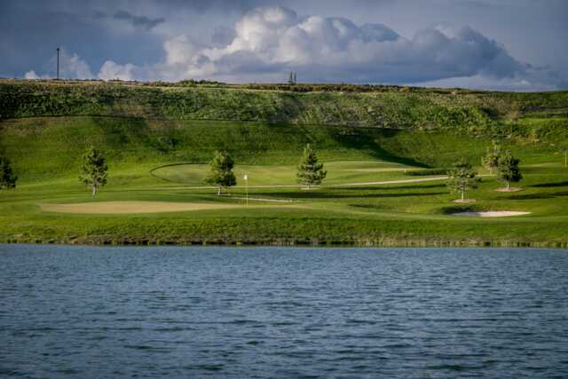 View of a green over the water from RedHawk Golf Course.